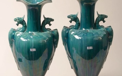 Pair of turquoise glazed earthenware vases with two...