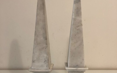 Pair of white marble obelisks, black marble base.