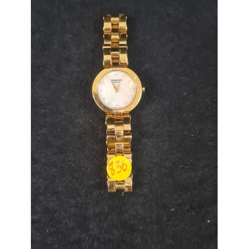 Raymond Weil ladies wrist watch with mother of pearl face.