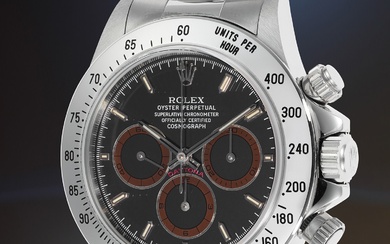 Rolex, Ref. 16520 A "new old stock", supremely attractive, and highly coveted stainless steel chronograph wristwatch with dark brown "tropical" subdials, bracelet, punched guarantee papers, and presentation boxes