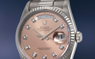 Rolex, Ref. 18239 A rare and well-preserved white gold and diamond-set calendar wristwatch with center seconds, salmon dial and bracelet