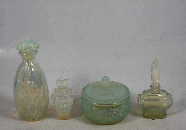 Sabino opalescent glass powder pot with lid, and three scent bottles.