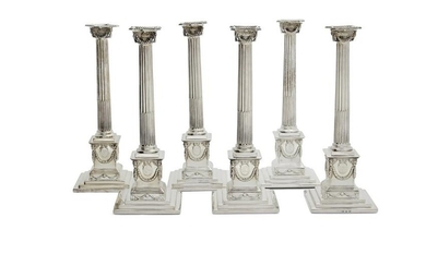 Six George III weighted silver candlesticks