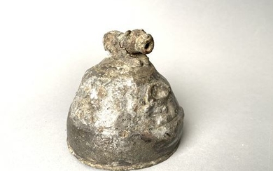 Small silver helmet topped with an animal head....