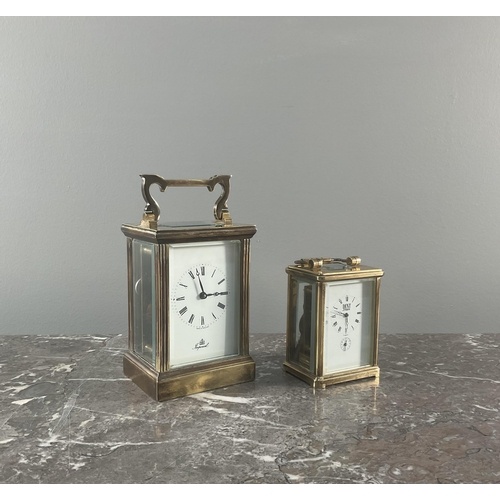Two brass carriage clocks, the larger bearing marks for 'Imp...