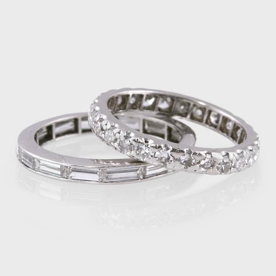 Two diamond and platinum eternity band rings