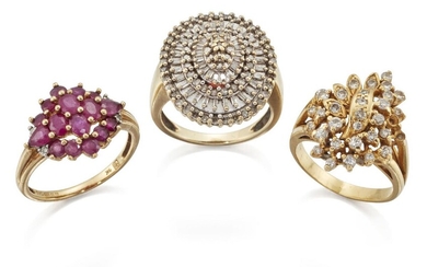 Two diamond rings and a ruby ring, the first a brilliant-cut diamond floral cluster ring, ring size K; the second a brilliant and baguette cut diamond alternate stepped row oval cluster ring, ring size N; and a 9ct gold, ruby cluster ring, ring...