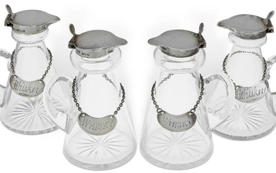 Two pairs of silver mounted whisky noggins by Hukin & Heath, the first pair Birmingham, 1926, with silver decanter labels engraved 'whiskey', (same date and maker), the second pair Birmingham, 1937, with silver decanter labels engraved 'whisky'...