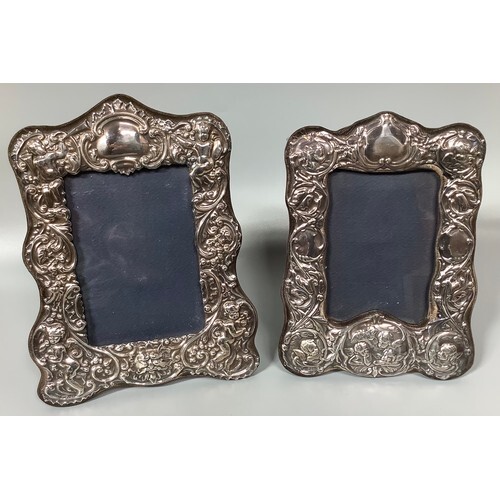 Two various ornate silver photo frames embossed with panels ...