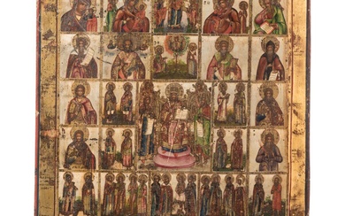 Une grande icône russe multipartite représentant le Christ en grand prêtre (déesse) avec plusieurs saints,...