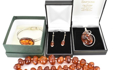 Various items of modern amber jewellery comprising graduated bead necklace,...