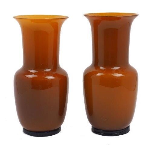 Amendment - Please Note - these vases are circa 1980Venini, a pair of 'Opalino' vases, originally designed by Paolo Venini, circa 2010, of tapered form with flared neck, in cased amber coloured glass on raised black ring, both inscribed 'Venini...