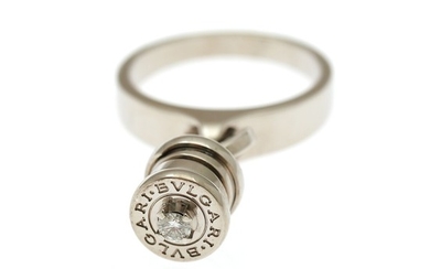 Bulgari: A “B.ZERO” diamond ring with a charm set with a brilliant-cut diamond, mounted in 18k white gold. Size 49.