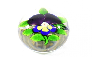 A Baccarat Pansy Paperweight, circa 1850, with two purple petals...