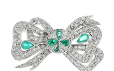 An early 20th century emerald and diamond bow brooch. View more details