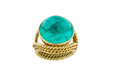 An emerald dress ring The circular cabochon emerald...