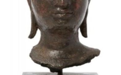 A fragmentary bronze head of Buddha Shakyamuni,...
