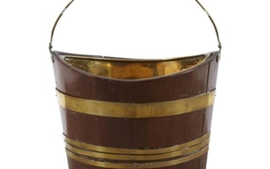 An Irish brass-bound and copper lined navette-form peat bucket...
