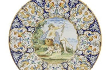 A large Italian maiolica charger 18th century The well...