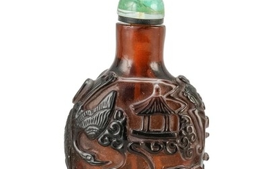 OVERLAY GLASS SNUFF BOTTLE In spade shape, with black-on-amber design of mythical creatures. Height 2.6". Green glass stopper.