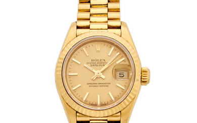 Rolex. An 18K gold lady's automatic calendar bracelet watch
