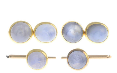 A star sapphire cabochon dress set, comprising a pair of cufflinks and two dress studs.