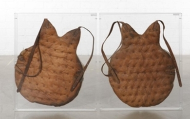 Two antique baseball catcher's chest guards