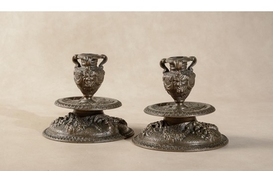 A pair of Venetian bronze candlesticks