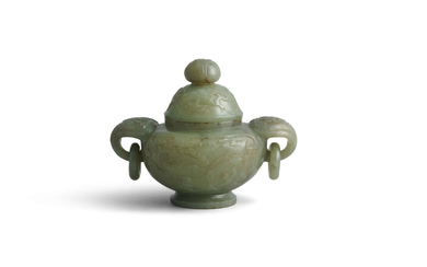 A WHITE JADE FIGURE OF...