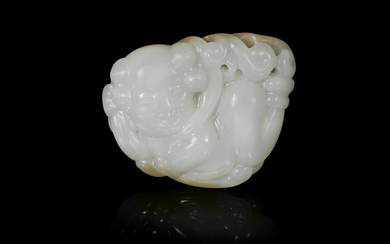 A white jade carving of an apsara