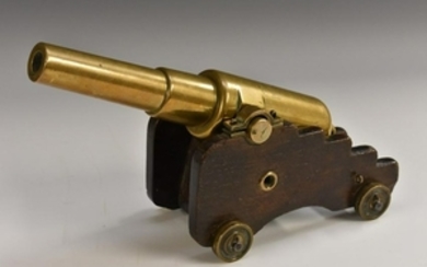 A 19th century bronze desk model signal canon, shaped