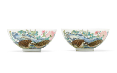 An exceptionally rare pair of Imperial famille rose 'quails and chrysanthemums' bowls