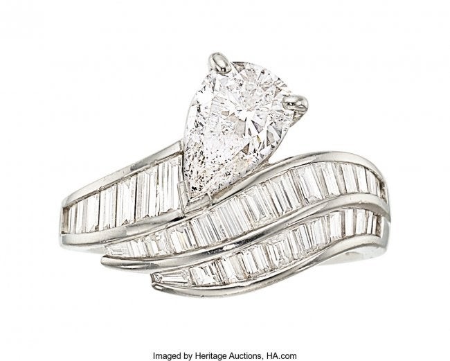 55222: Diamond, Platinum Ring The ring features a pear