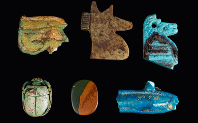 7 AMULETS, Egypt, Late Roman period, 663 BC-200 AD, upper part of god in jackal shape, faience, udjat eyes in hard green coloured mineral and faience, fish in blue glass, pearl possibly in jasper, fragments of scarab and fragments in faience of amulet.