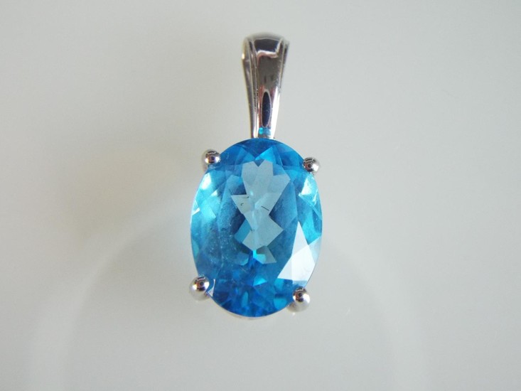 9ct White gold pendant set with a Swiss, electric blue oval ...