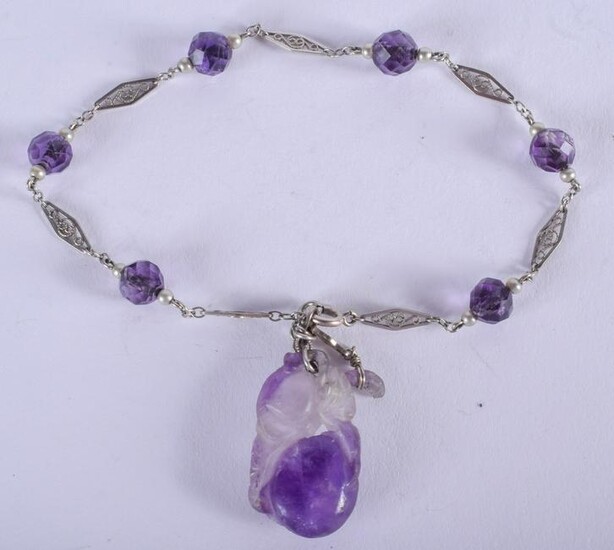 A 1920S WHITE GOLD AND AMETHYST BRACELET. 15 cm long.