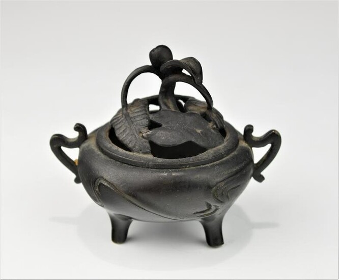 A 19TH CENTURY CHINESE BRONZE CENSOR WITH PIERCED LID