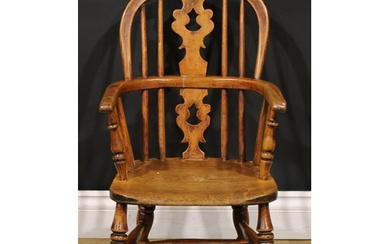 A 19th century ash and elm child’s Windsor elbow chair, pier...