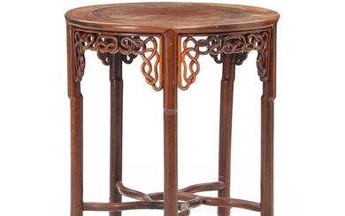 SOLD. A 20th century round Chinese hardwood and walnut table, decorated with openwork carvings. H. 83. Diam. 77 cm. – Bruun Rasmussen Auctioneers of Fine Art