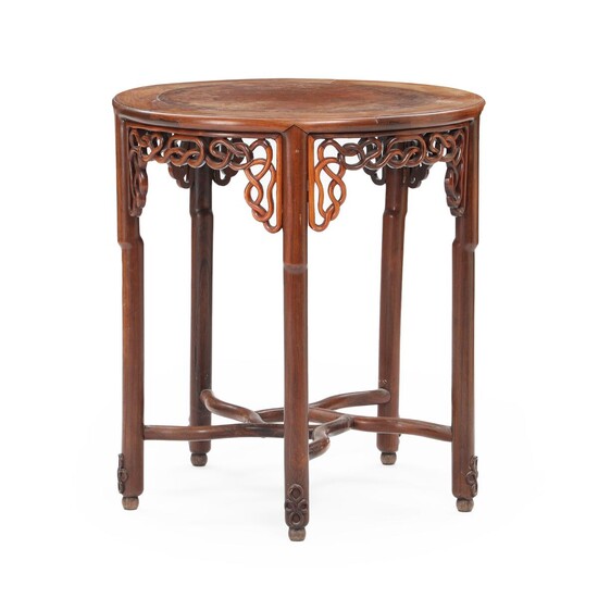 SOLD. A 20th century round Chinese hardwood and walnut table, decorated with openwork carvings. H. 83. Diam. 77 cm. – Bruun Rasmussen Auctioneers of Fine Art