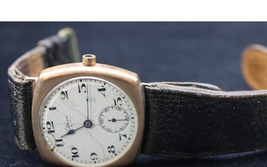 A 9ct gold gentlemen's wristwatch with white enamel dial, se...