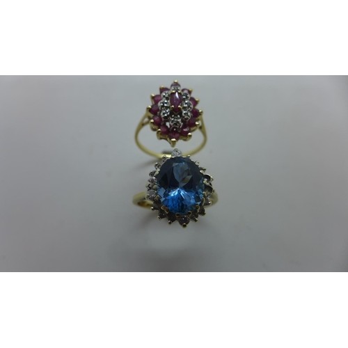 A 9ct gold oval ruby and diamond cluster ring set with thirt...