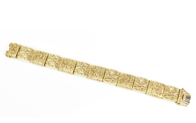 A 9ct yellow gold Modernist style bracelet, with alternated ...