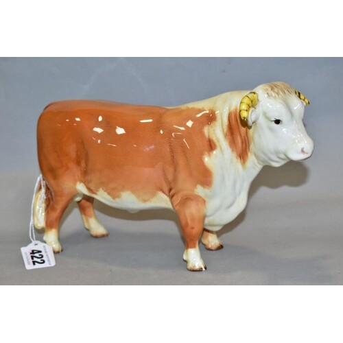 A BESWICK HEREFORD BULL, No 949, in red colourway, circular ...