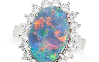 A BLACK OPAL AND DIAMOND CLUSTER RING set with an oval cabochon black opal of approximately 3.92 ...
