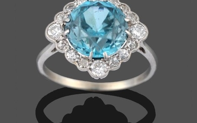 A Blue Zircon and Diamond Cluster Ring, the round cut...