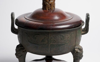 A CHINESE ARCHAISTIC BRONZE 'DING' CENSER WITH JADE-EMBELLISHED HARDWOOD LID QING DYNASTY (1644-1912), 18TH CENTURY OR EARLIER