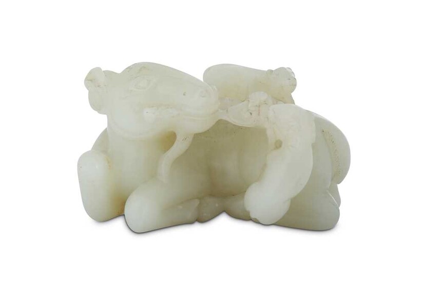 A CHINESE WHITE JADE 'RAM' CARVING.