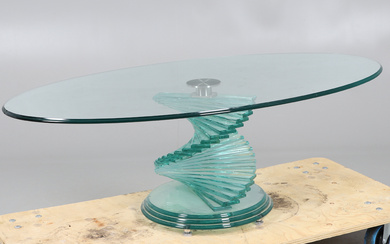A CONTEMPORARY GLASS LOW CENTRE TABLE IN THE MANNER OF DANNY LANE.