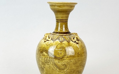 A Chinese Yuan Dynasty style incised olive green glazed pottery vase, H. 21cm.